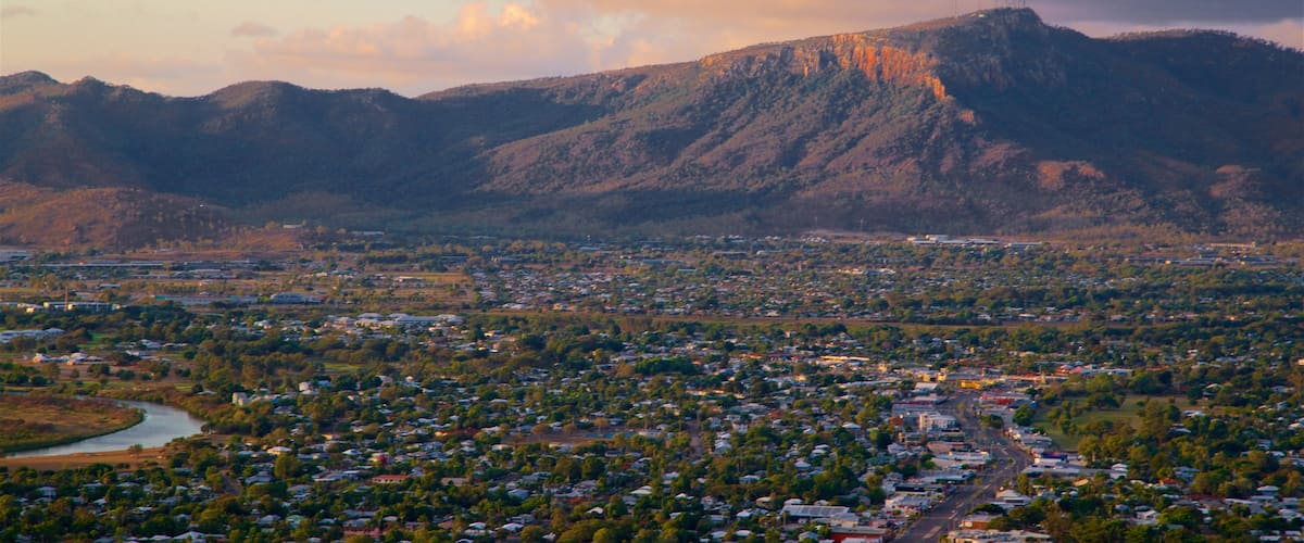 Mount Stuart showing a small town or village, a sunset and mountains