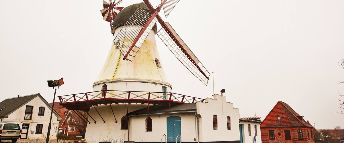 Vejle featuring a lighthouse and mist or fog