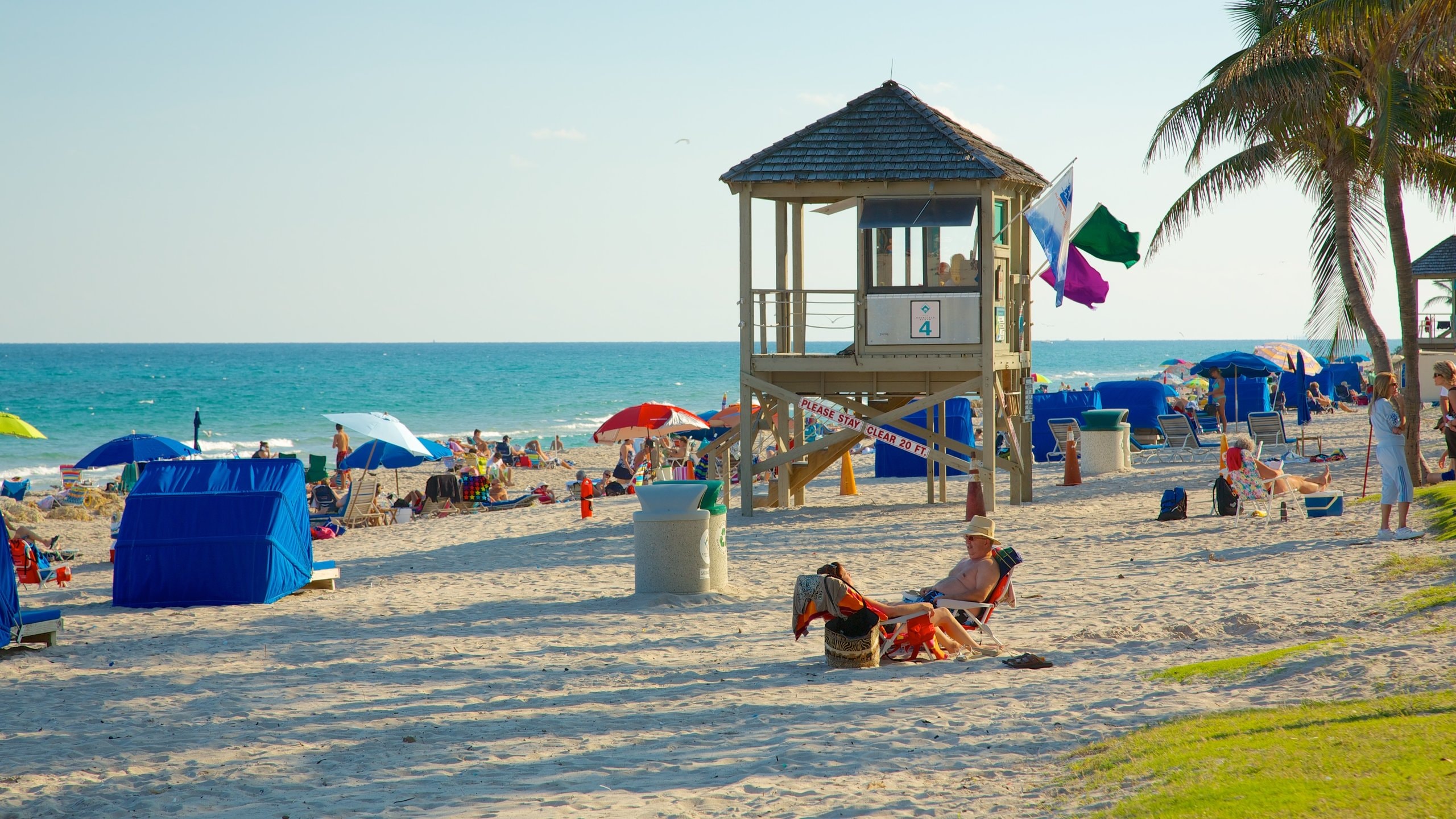 Deerfield Beach Pier which includes a sandy beach, landscape views and tropical scenes