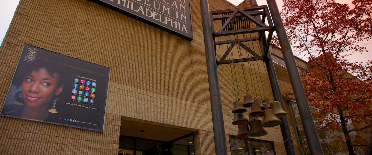 African American Museum featuring signage and a city