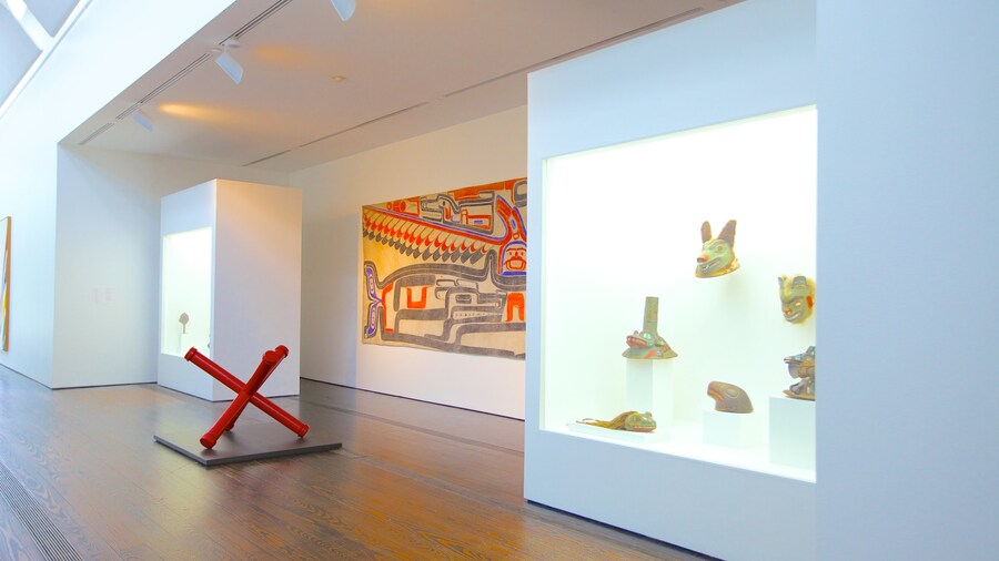 Interior gallery of the Menil Collection in Houston showcasing modern art and cultural artifacts in a bright minimalist space.