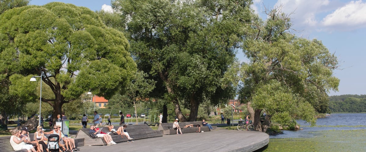 Sigtuna which includes a lake or waterhole as well as a small group of people