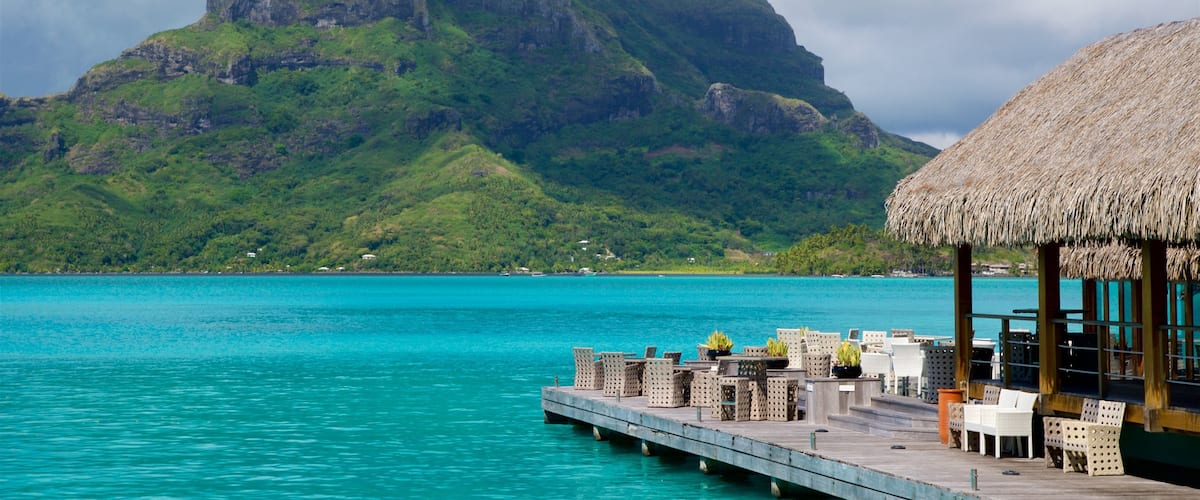 Society Islands featuring mountains, general coastal views and tropical scenes
