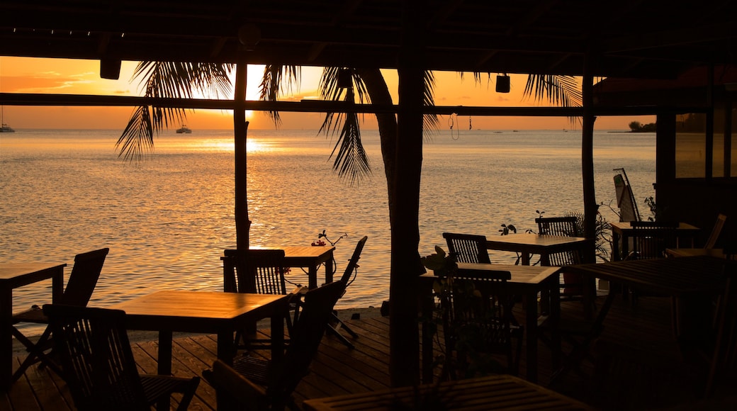 Matira Beach featuring a sunset, general coastal views and interior views