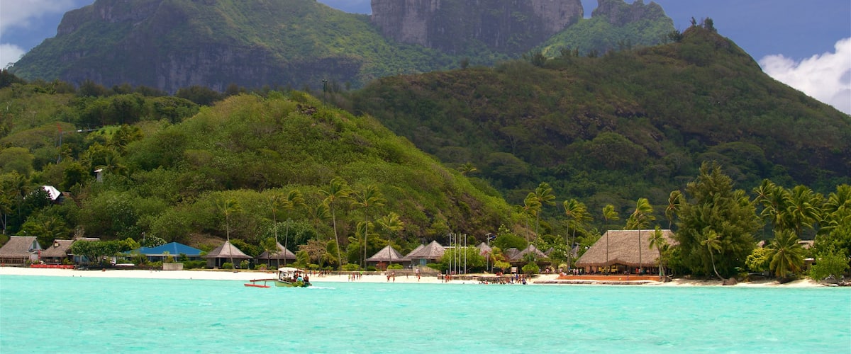 Matira Point featuring general coastal views, tropical scenes and mountains