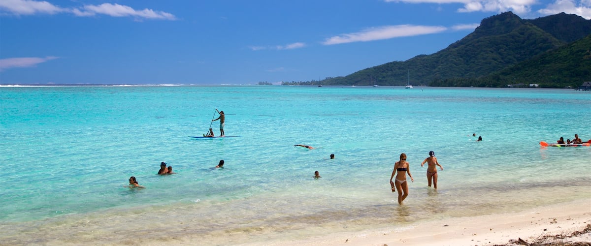 Temae Beach which includes a sandy beach, general coastal views and swimming