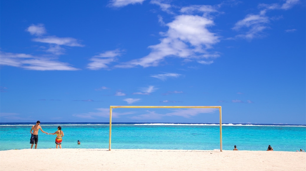 Temae Beach showing a sandy beach and general coastal views as well as a couple