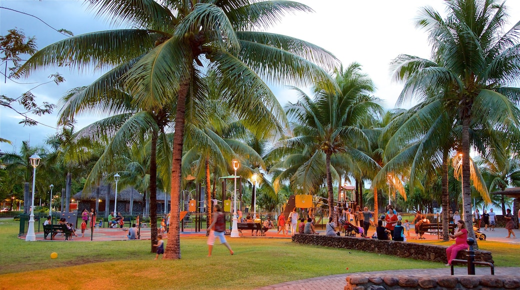 Papeete showing a garden as well as a small group of people