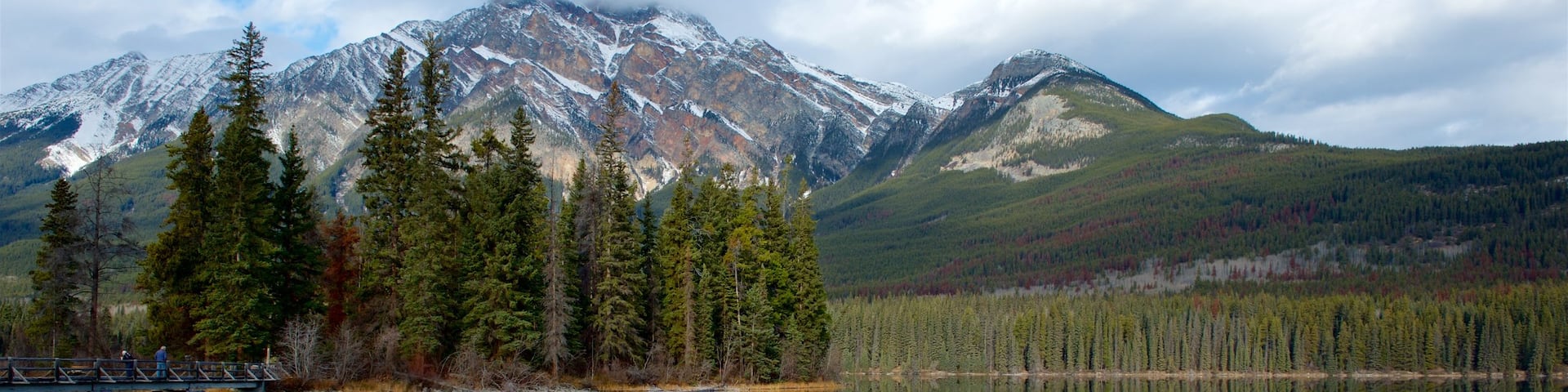 Jasper National Park showing mountains, a river or creek and tranquil scenes