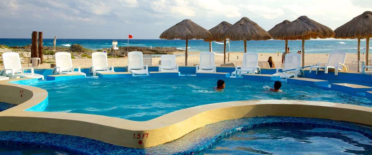 Punta Morena which includes a pool, tropical scenes and swimming