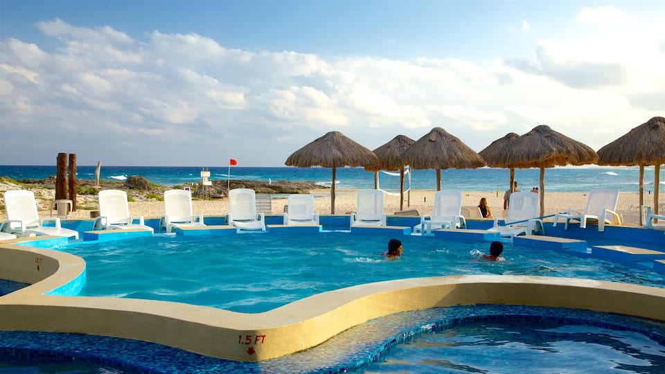 Punta Morena which includes a pool, tropical scenes and swimming