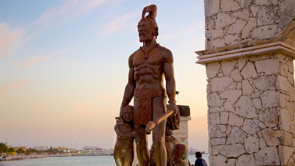 Cozumel which includes a sunset, a statue or sculpture and a monument
