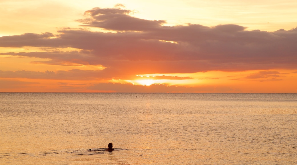 Ancon Beach which includes general coastal views, a sunset and landscape views