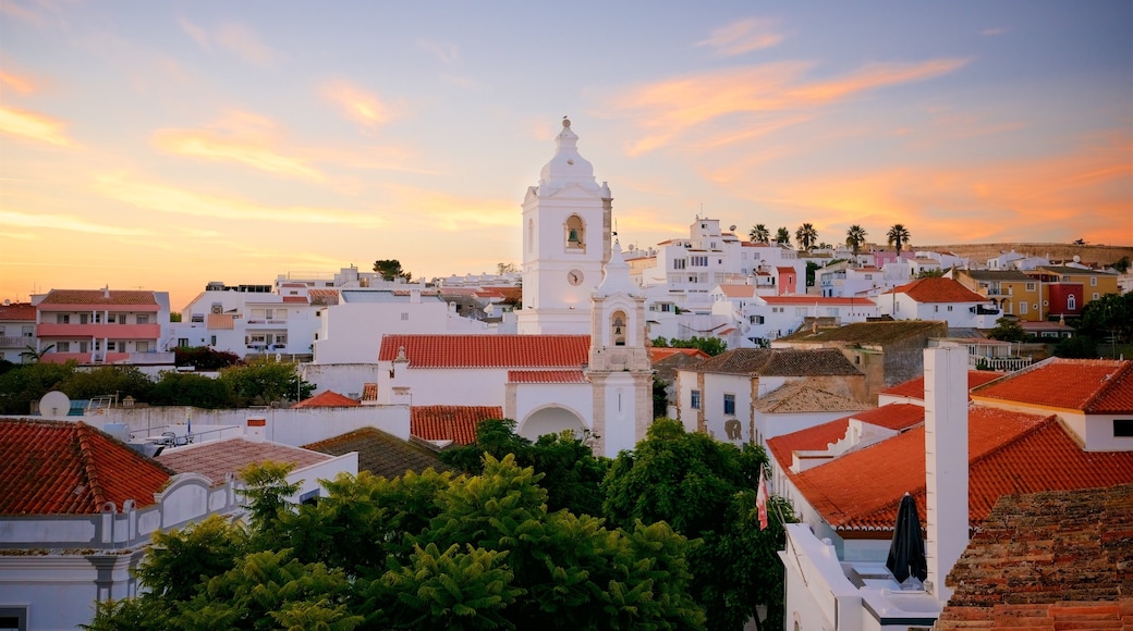 Santo Antonio Church which includes a city and a sunset