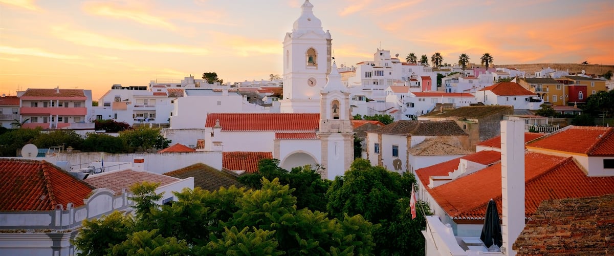 Santo Antonio Church which includes a city and a sunset
