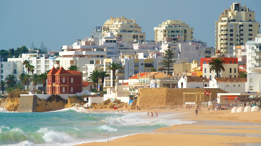 Salgados Beach featuring waves, a city and a beach