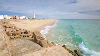 Faro strand som inkluderer sandstrand og kyst