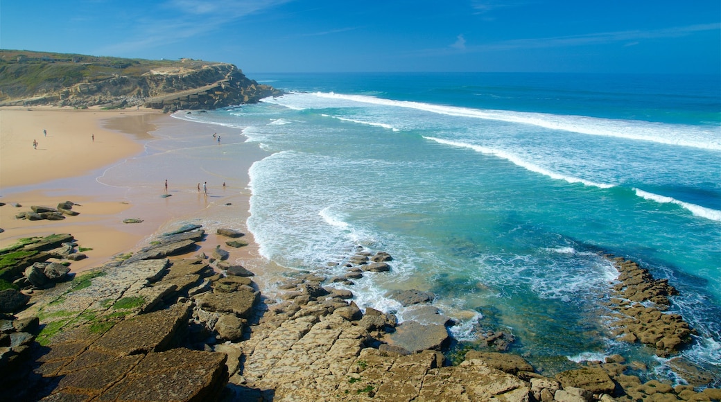 Macas Beach showing waves, a beach and rocky coastline