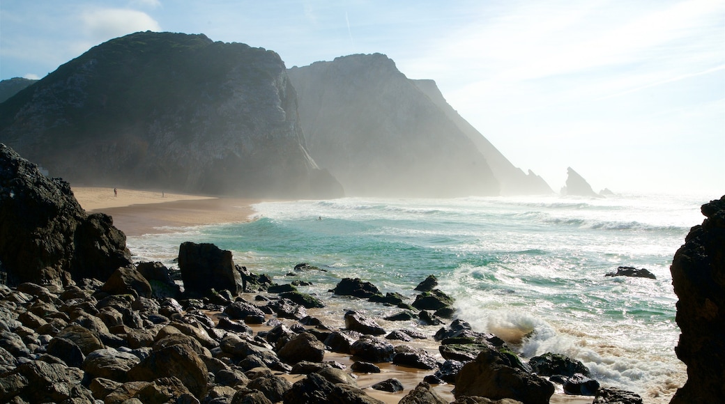 Adraga Beach which includes a sandy beach, rugged coastline and general coastal views