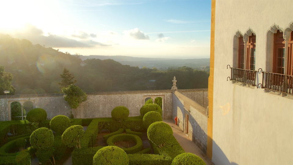 Sintra National Palace which includes tranquil scenes, a sunset and a park