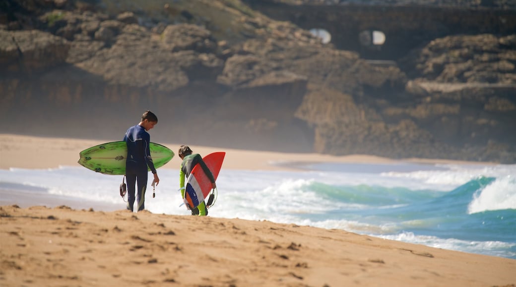 Guincho Beach which includes a sandy beach and general coastal views as well as children