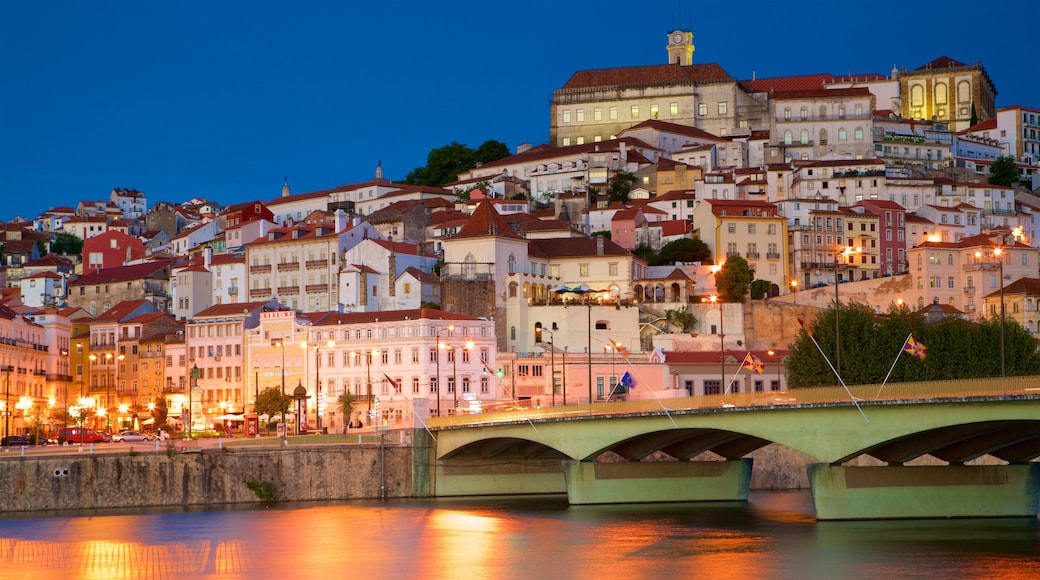 Coimbra showing night scenes, a bridge and a city