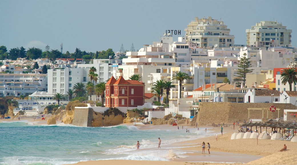 Salgados Beach mostrando una playa, una localidad costera y vistas de una costa