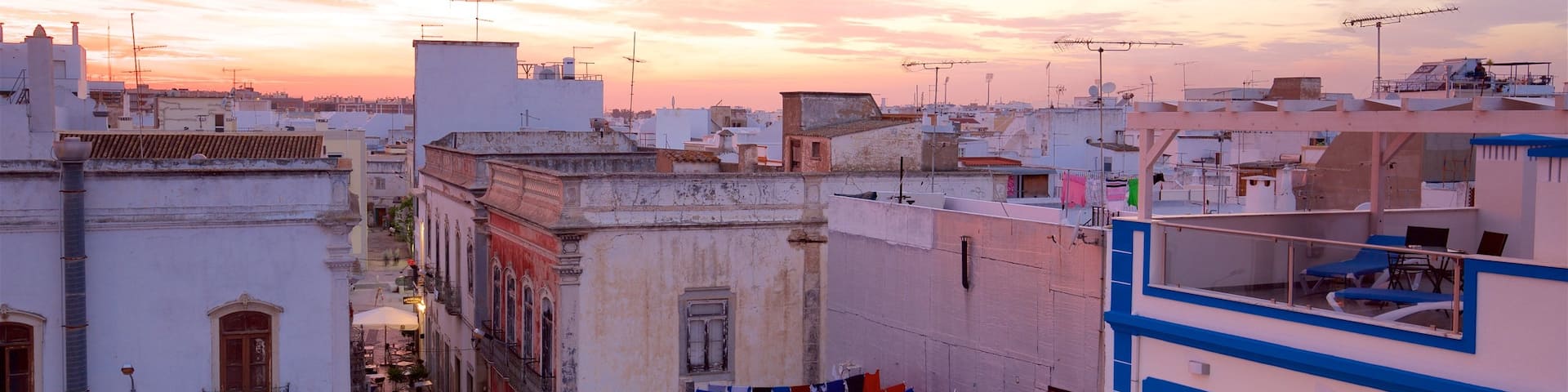 Olhao which includes a sunset and a city