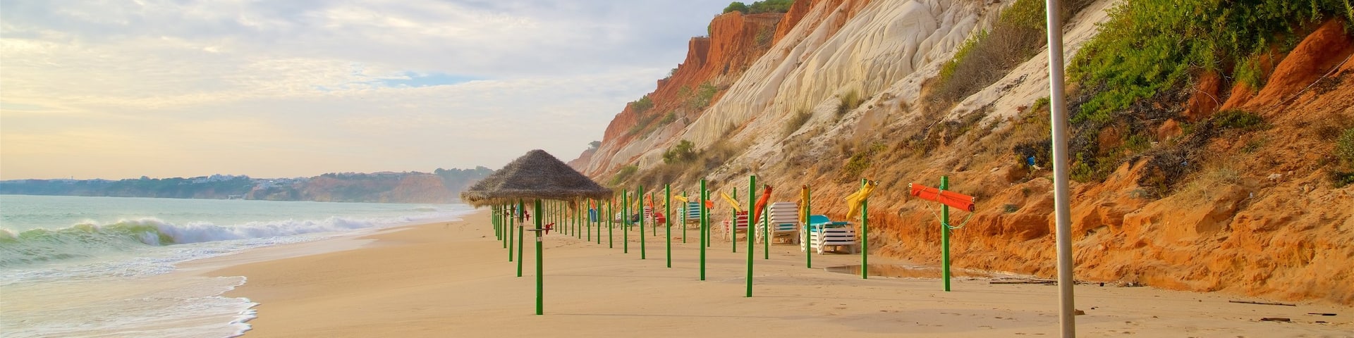 Falesia Beach showing a beach, general coastal views and rocky coastline