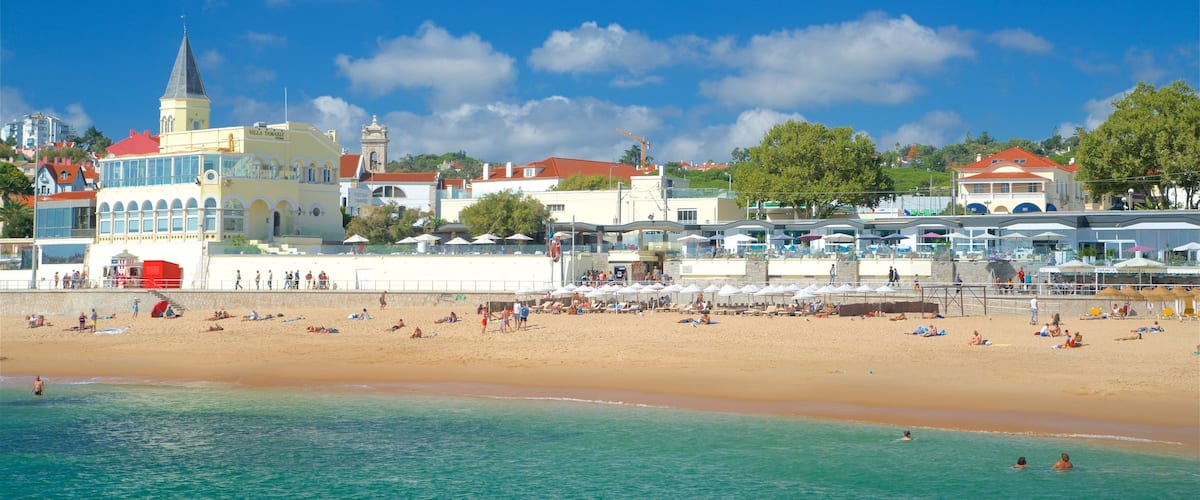 Tamariz Beach showing swimming, general coastal views and a beach