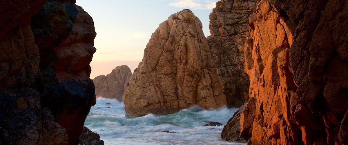 Ursa Beach showing a sunset, general coastal views and rugged coastline
