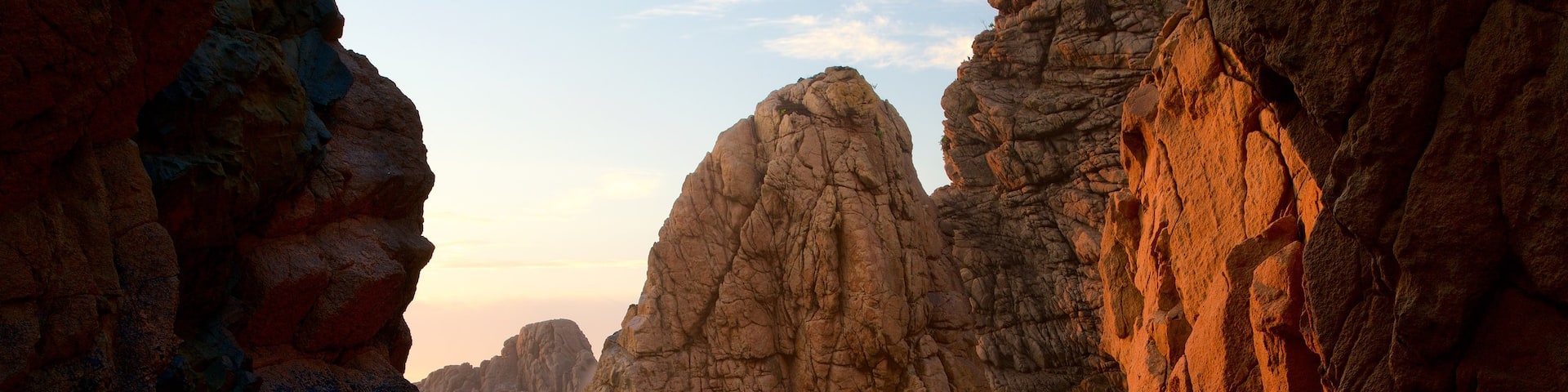Ursa Beach showing a sunset, general coastal views and rugged coastline