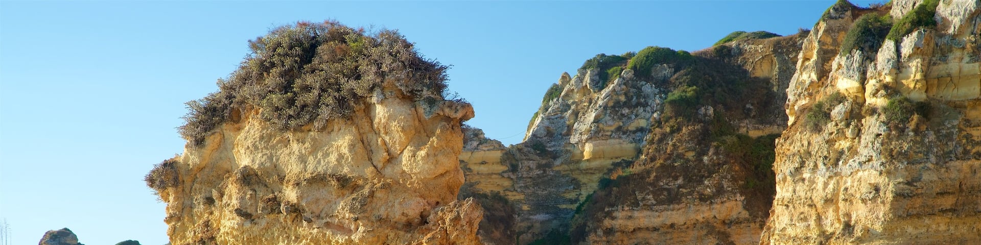 Dona Ana Beach which includes general coastal views, rocky coastline and a beach