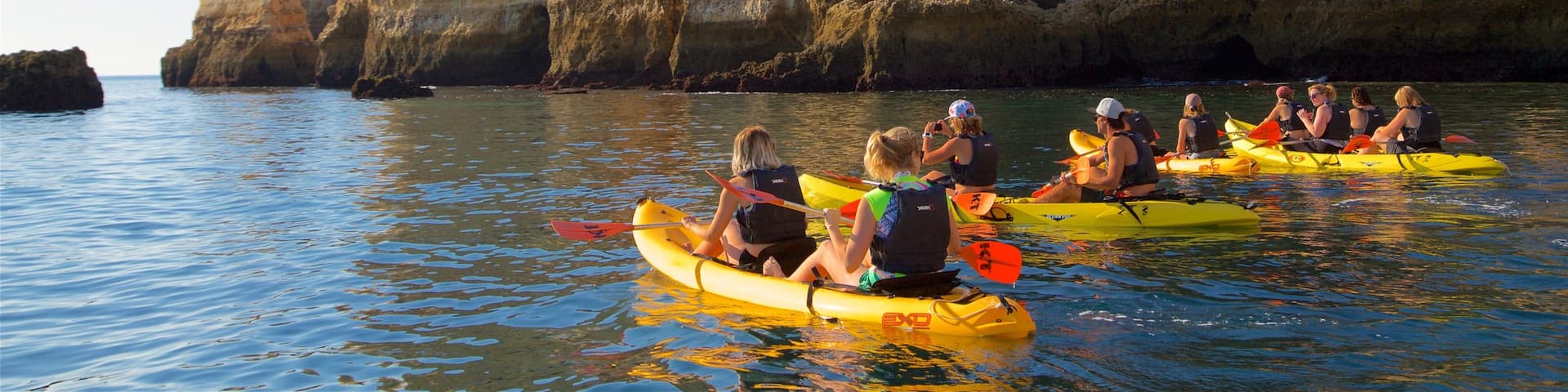 Lagos Lighthouse featuring general coastal views, kayaking or canoeing and rocky coastline