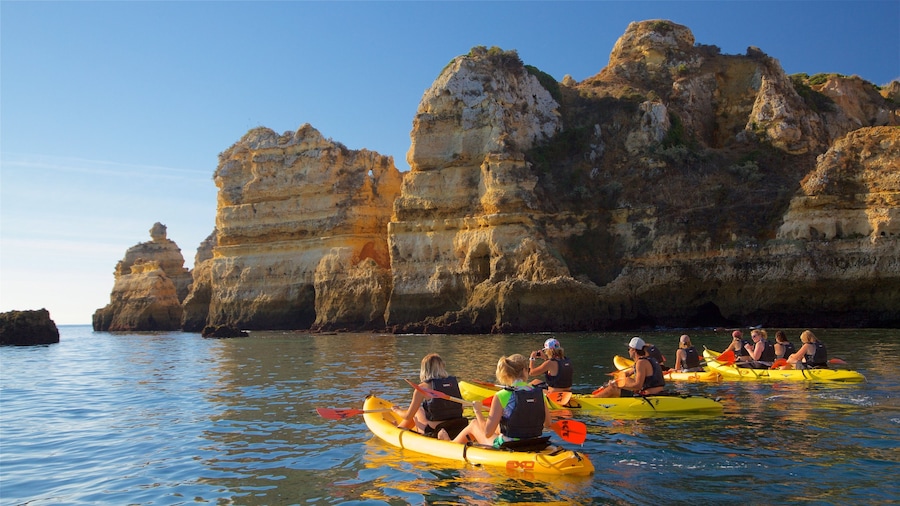 Lagos Lighthouse featuring general coastal views, kayaking or canoeing and rocky coastline
