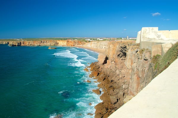 Sagres Fortress featuring general coastal views, rugged coastline and a sandy beach