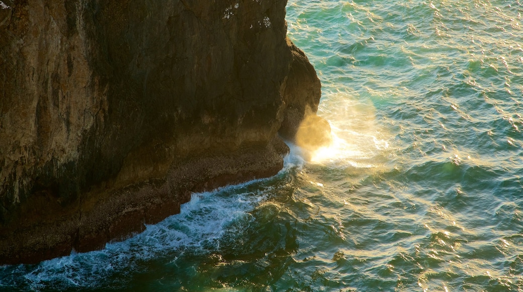 Cape St. Vincent Lighthouse which includes rugged coastline, general coastal views and a sunset