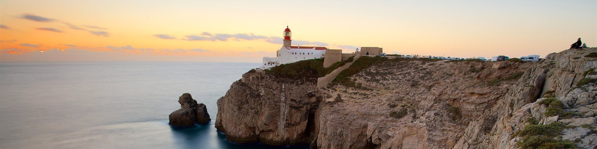 Cape St. Vincent Lighthouse featuring a sunset, general coastal views and a lighthouse