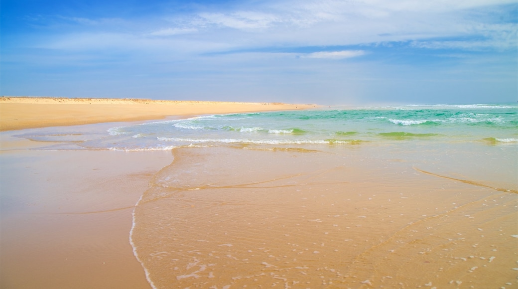 Fuzeta Beach which includes a sandy beach and general coastal views