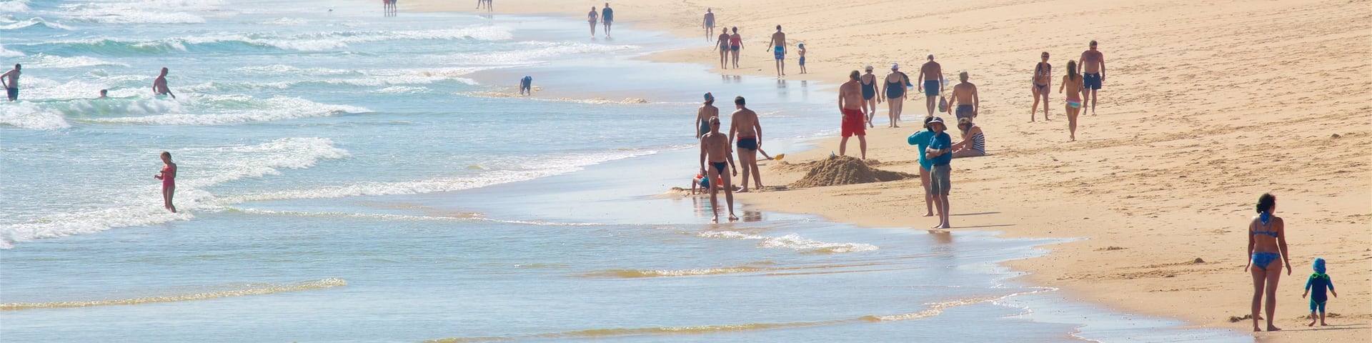Ilha de Tavira Beach which includes general coastal views, swimming and a beach