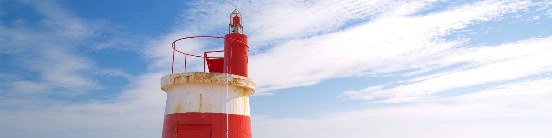 Ilha de Tavira Beach featuring general coastal views and a lighthouse