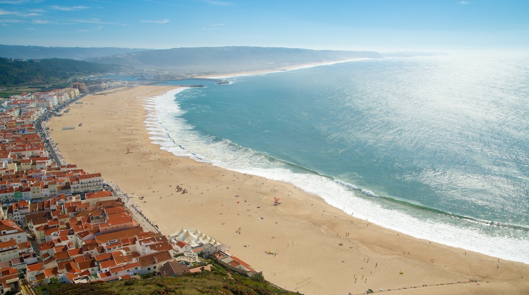 Nazare showing a coastal town, a beach and general coastal views