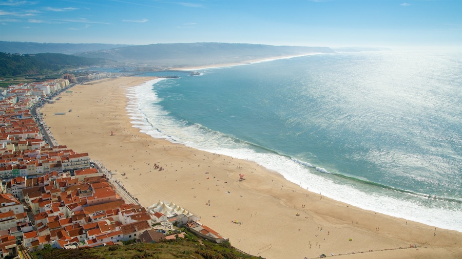 Nazare which includes general coastal views, a sandy beach and a coastal town