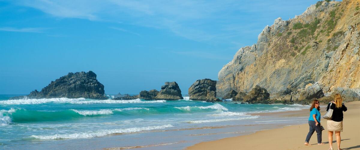 Adraga Beach featuring general coastal views, rocky coastline and a beach