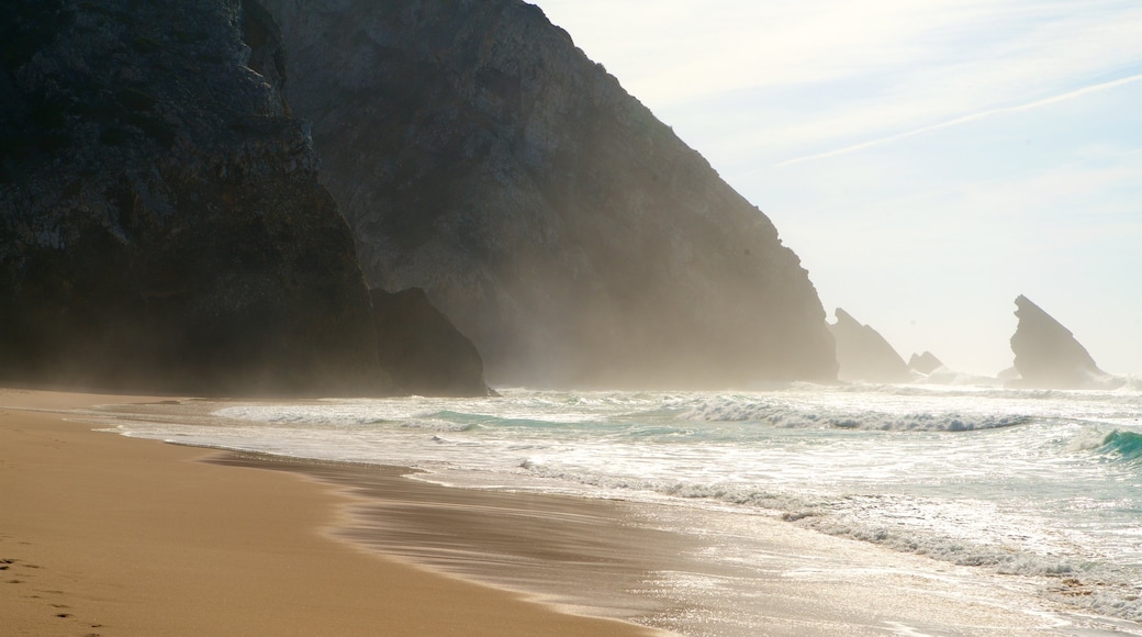 Adraga Beach which includes rocky coastline, a beach and general coastal views