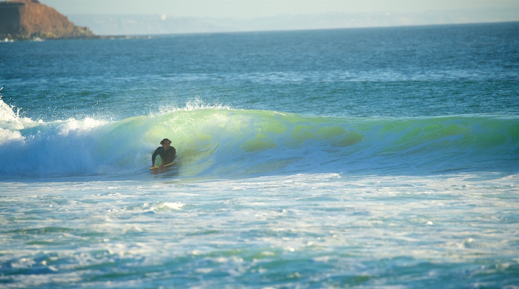 Supertubos Beach showing waves, surfing and general coastal views