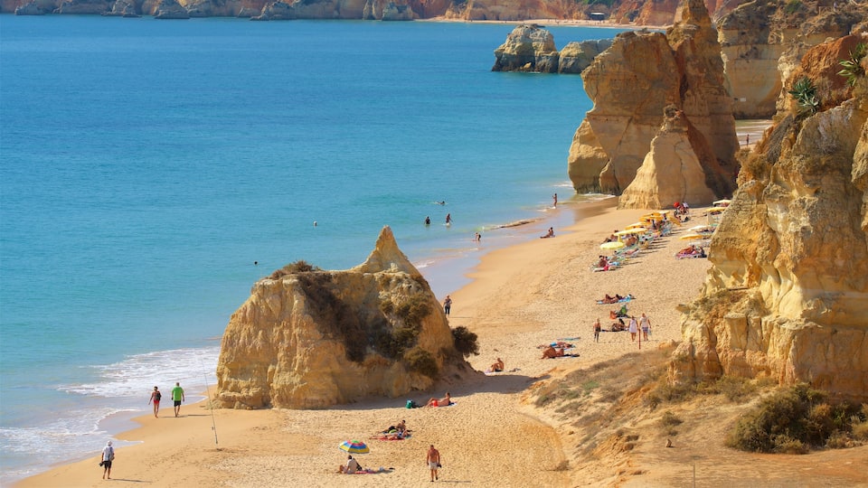 Rocha Beach featuring a sandy beach, general coastal views and rugged coastline