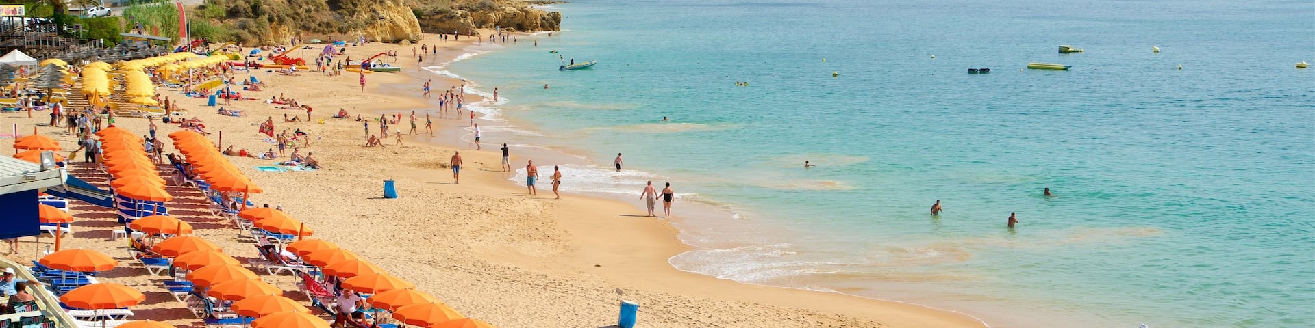 Oura Beach showing a sandy beach, general coastal views and swimming