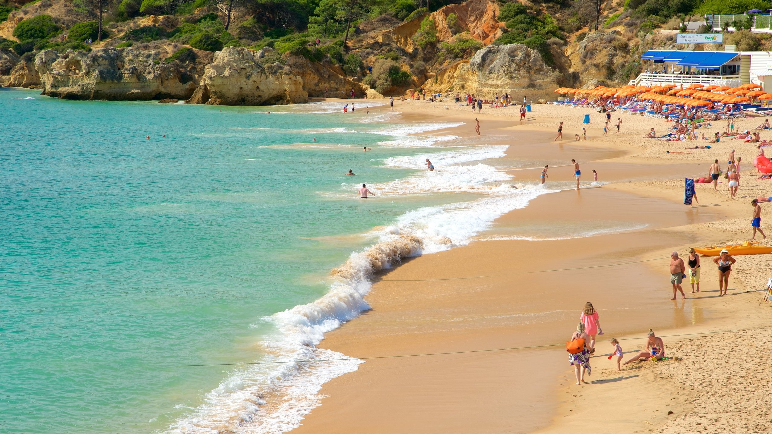 Oura Beach featuring swimming, a sandy beach and general coastal views