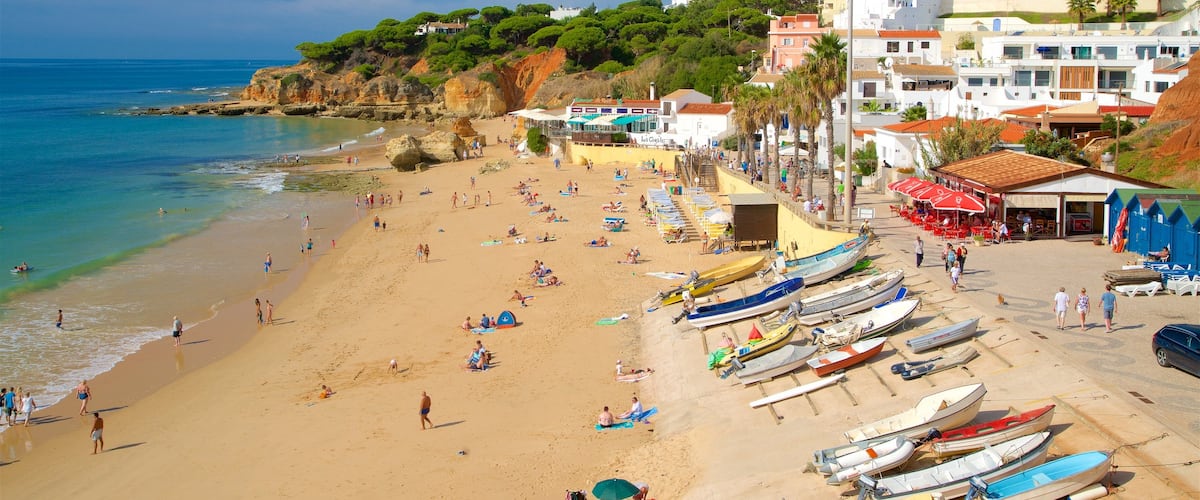Olhos D\'Agua Beach which includes a sandy beach, general coastal views and a coastal town